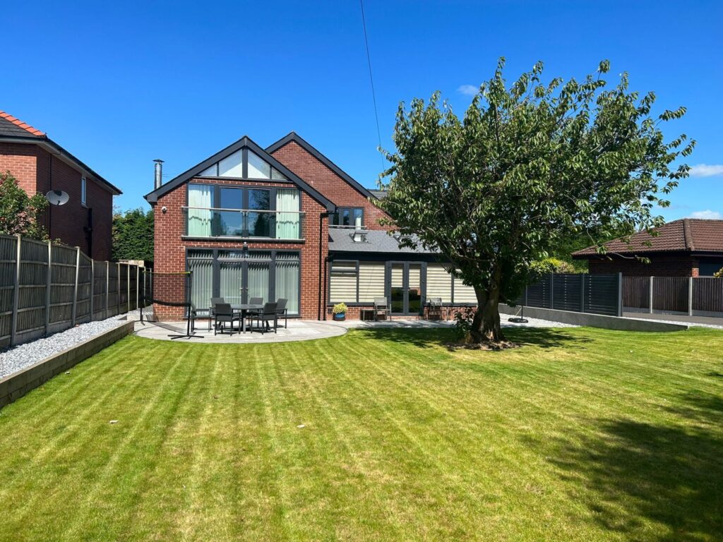 Home with triple glazed windows, doors and roofline in anthracite grey