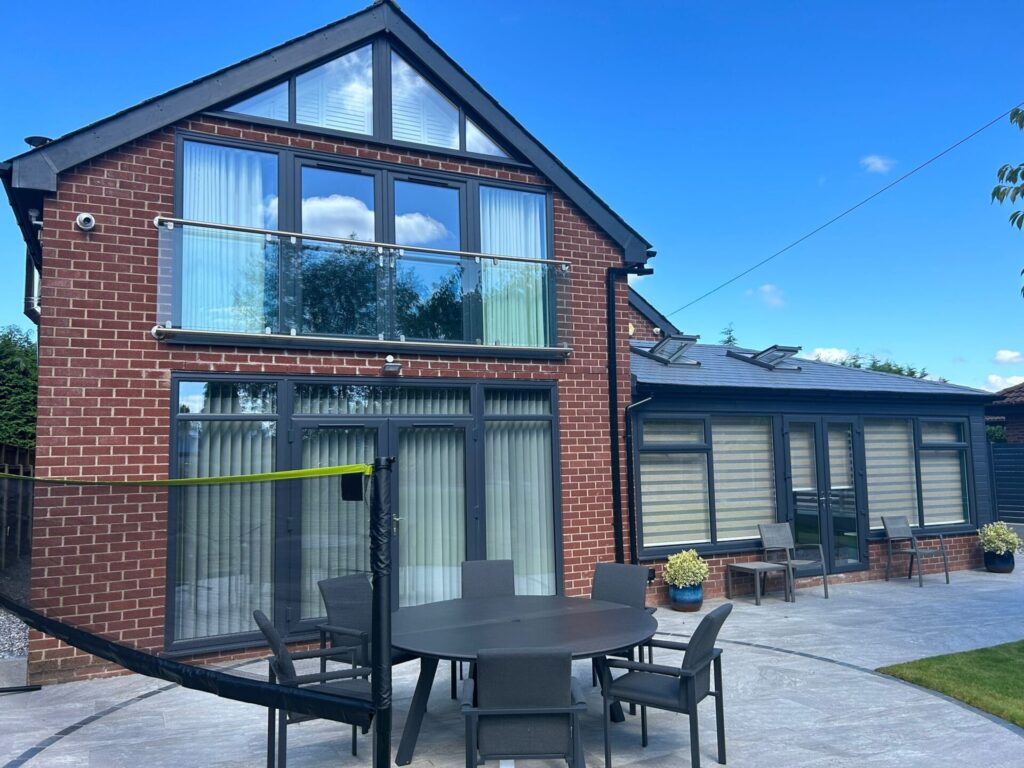 Home with triple glazed windows, doors and roofline in anthracite grey