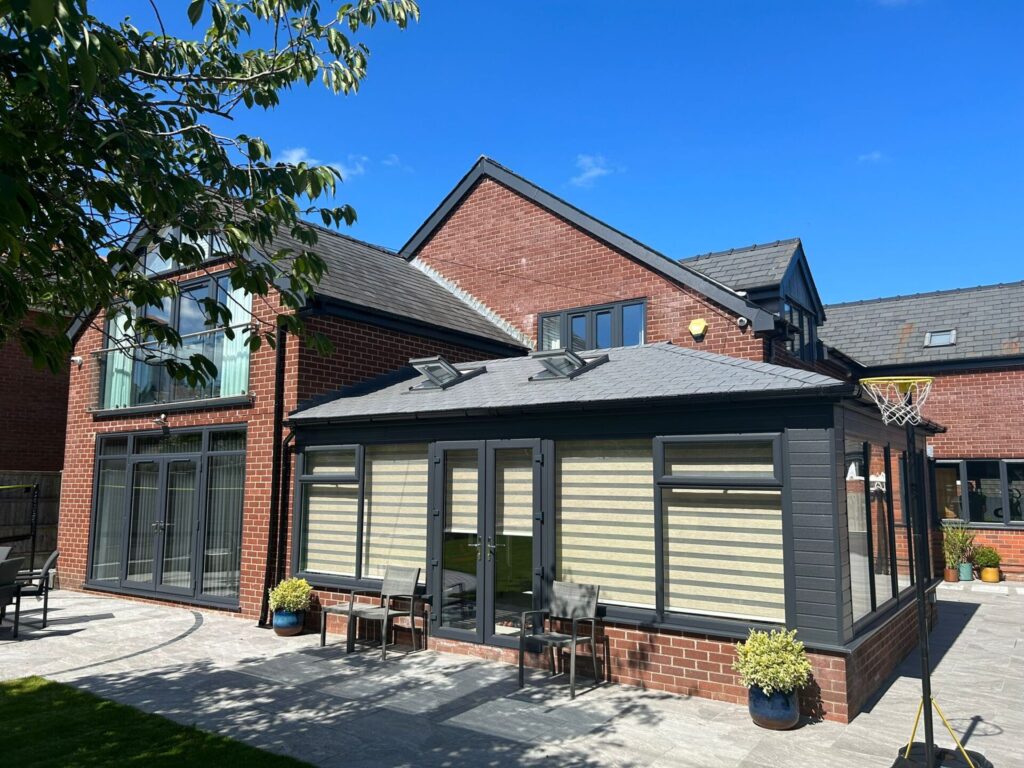 Home with triple glazed windows, doors and roofline in anthracite grey