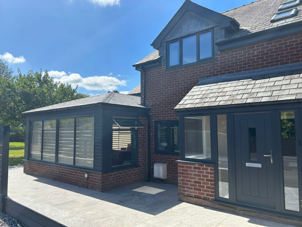 Home with triple glazed windows, doors and roofline in anthracite grey